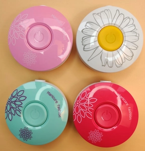 Top view of four portable electric manicure fans in pink, white, mint, and rose colors