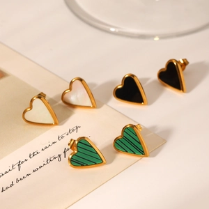 Golden heart earrings with white mother of pearl, black, and green malachite insets