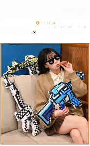 Plush long gun throw pillow with pixelated design in blue, yellow and black patterns