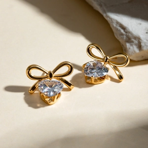 18k gold plated stainless steel bow earrings with heart-shaped white zircon pendants