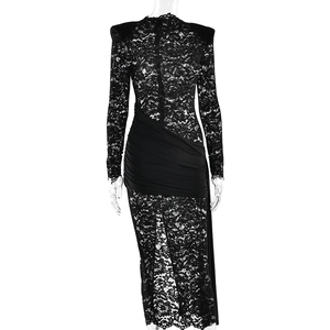 Close-up of black lace texture and draped waist detail on long sleeve slim dress