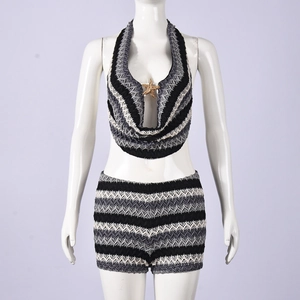 Detail of crochet knit crop top with wave patterns and golden starfish pendant