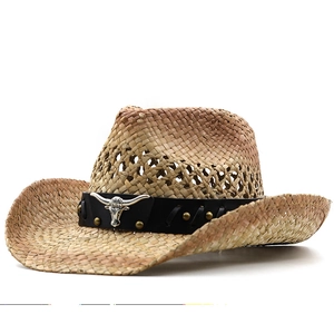 Handmade straw cowboy hat with ventilated crown and leather band featuring a metal bull head