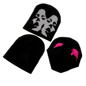 Three-piece set of black knitted beanies with face pattern and pink horn accents