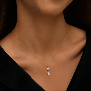 Macro shot of 925 silver square zircon pendant necklace on a model showing daily wear