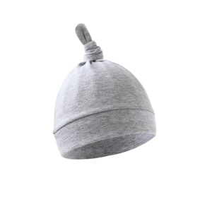 Detail showing the soft grey fabric texture and knot design of this newborn baby beanie