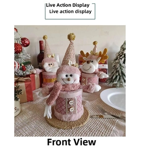 Pink Christmas candy jars with Snowman Santa and Reindeer designs on a festive table
