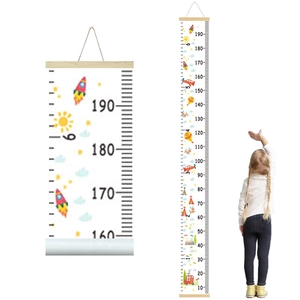 Hanging canvas growth chart with colorful cartoon rockets and planes for nursery decor