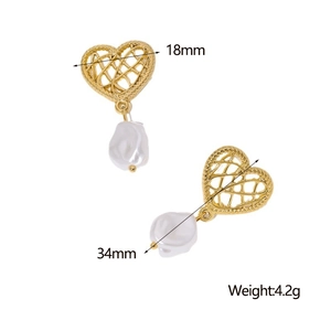 Detail view of 18K gold hollow heart earrings with irregular white baroque pearls