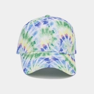 Detailed close-up of rainbow tie-dye baseball cap showing fabric texture and vibrant colors