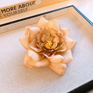 Elegant beige and orange gradient orchid hair claw clip made of delicate silk fabric