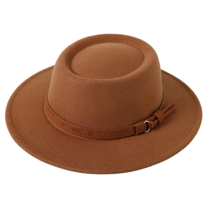 Macro detail of brown wool felt wide brim hat featuring a premium leather band and gold buckle