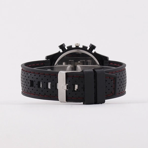 Black sport quartz watch featuring red stitching on silicone band with silver metal buckle