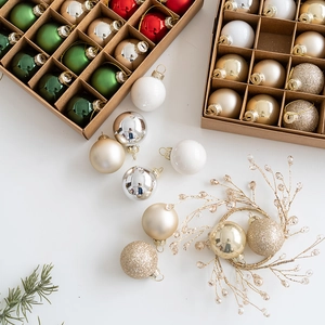Festive Christmas ball ornaments set in various finishes on a white holiday background