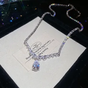 Elegant silver teardrop pendant necklace with pear-cut zircon on a crystal tennis chain