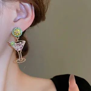 Summer vacation lime cocktail earrings with pearls and silver needle studs on model