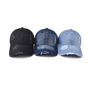 Three colors of distressed denim baseball caps with vintage ripped edges and adjustable strap
