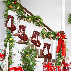 Set of 4 red and black buffalo plaid Christmas stockings with plush white faux fur trim