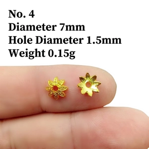Macro shot of 7mm gold-plated 8-petal flower bead caps for DIY jewelry making