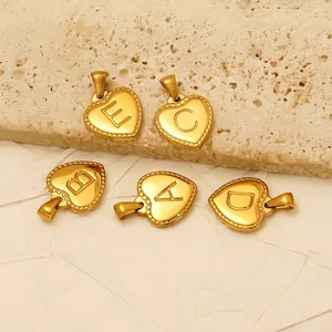 Golden stainless steel heart pendants with A-E letter engravings and beaded edge trim