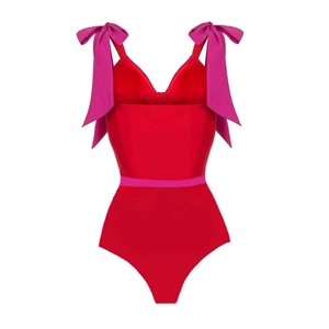 Red one-piece swimsuit with pink bow shoulder straps and waist tie details