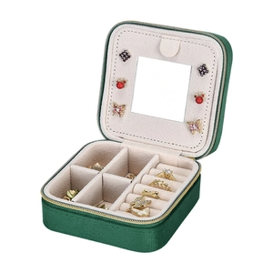 Portable dark green velvet jewelry travel case with mirror and zip closure for rings