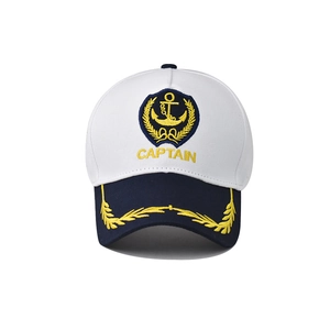 White nautical captain baseball cap with gold anchor embroidery and navy blue brim visor