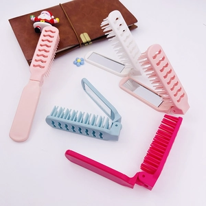 Mini folding travel hairbrush set with mirror in multiple colors on a clean white background