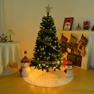 White plush Christmas tree skirt with snowflake sequins on a decorated holiday tree