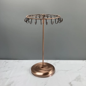 Rotating bronze iron jewelry rack for displaying necklaces and earrings with many hooks