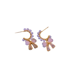 Golden C-shaped earrings with pearls, pink hearts, and ribbon bow charms in coquette style