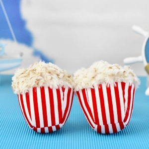 Close-up view of cute popcorn plush charms featuring soft texture and striped cups