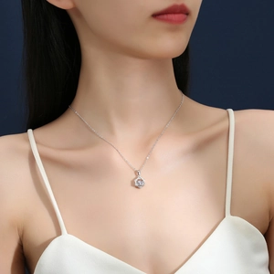 Sparkling S925 sterling silver hexagon star necklace with moissanite on female model