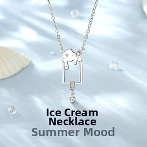 Close-up of silver popsicle pendant with zircon inlays on blue silk background