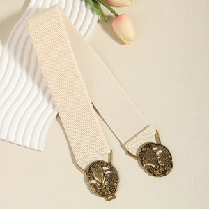 Detail of vintage bronze crane buckle on beige elastic belt with tulip decor