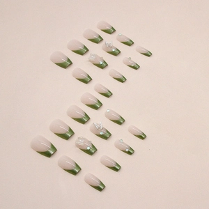 French matcha green press-on nails with 3D butterfly, pearls, and sparkling rhinestones