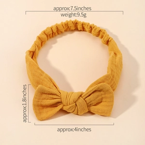 Yellow fabric baby bow headband with size measurements and soft elastic floral textile