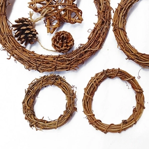 Natural rattan Christmas wreaths with pine cones and woven stars for DIY holiday decor