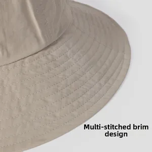 Close-up of sun hat brim with reinforced multi-line stitching on breathable fabric