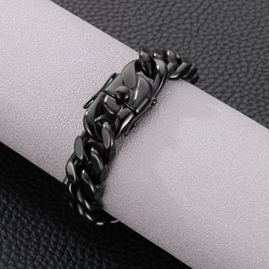 Macro view of black stainless steel Cuban chain bracelet with secure lobster clasp