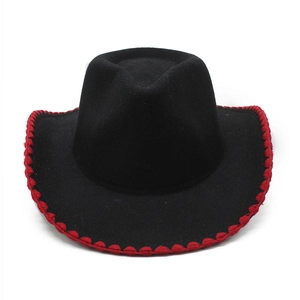 Detail of western cowboy hat featuring red wavy stitched edges on black felt brim