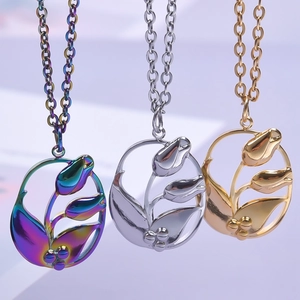 Tulip pendant necklace in gold, silver, and iridescent finishes with hollow design