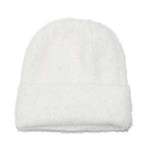 Close-up of soft white faux mink fur knitted beanie with plush thermal texture