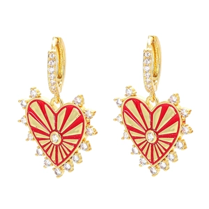 Elegant gold earrings with red enamel hearts and sparkling zircon stones on white background