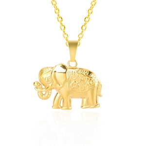 Detail view of a golden elephant pendant with floral engravings and a polished metal finish