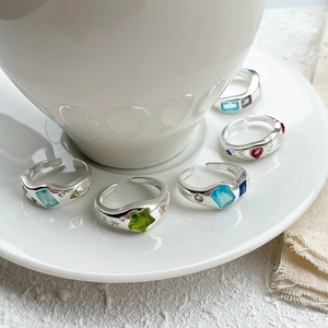 Close-up of S925 sterling silver open rings with colorful zircon heart and star shapes