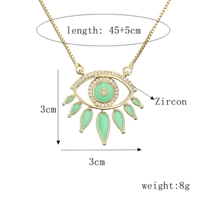 Gold evil eye pendant necklace with green enamel, zircon stones and water drop charms