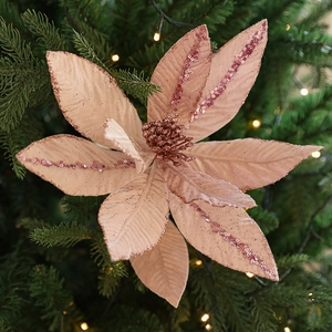 Elegant mauve velvet poinsettia Christmas pick with glitter edges on festive tree