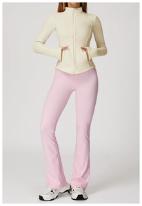 Detail of a soft off-white fleece zip jacket paired with pink high-stretch yoga pants