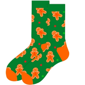 Detail of green Christmas sock with gingerbread man pattern and festive star accents